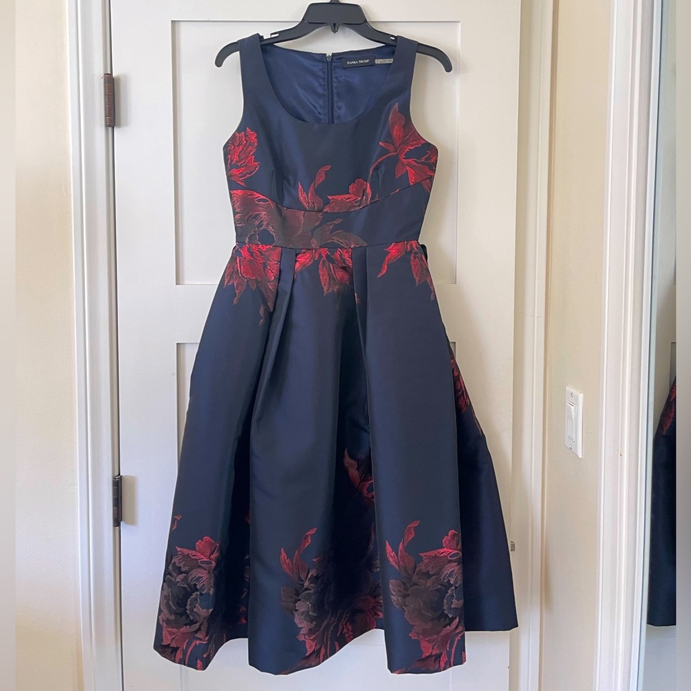 Elegant navy blue Ivanka Trump dress with sparkly red flowers